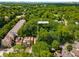 A high aerial view showcasing the property site within a neighborhood with mature trees and landscaping at 1200 Mansfield Ne Ave, Atlanta, GA 30307