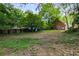 Backyard features mature trees and a detached brick house offering ample privacy at 1200 Mansfield Ne Ave, Atlanta, GA 30307
