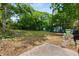 Spacious backyard with lush greenery, potential for landscaping and outdoor activities at 1200 Mansfield Ne Ave, Atlanta, GA 30307
