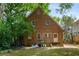 Exterior view of the brick home featuring a well-maintained garden, stairs, and nearby street access at 1200 Mansfield Ne Ave, Atlanta, GA 30307