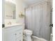 Standard bathroom with a vanity, commode, and tiled shower/tub at 1625 Hawkins Cove Trl, Roswell, GA 30076