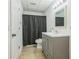 Clean bathroom with a vanity and a combined shower and tub at 1625 Hawkins Cove Trl, Roswell, GA 30076
