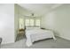 Bright primary bedroom featuring bay windows, a ceiling fan, and neutral decor at 1625 Hawkins Cove Trl, Roswell, GA 30076
