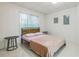 Simple bedroom with a sleek bed frame and tiled floor at 1625 Hawkins Cove Trl, Roswell, GA 30076
