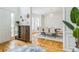 Bright foyer showcasing hardwood floors and an open floor plan leading to the dining area at 1625 Hawkins Cove Trl, Roswell, GA 30076