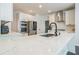Bright kitchen featuring white cabinets, quartz countertops, and stainless steel appliances at 1625 Hawkins Cove Trl, Roswell, GA 30076