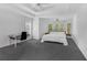 Bright primary bedroom features bay windows, a ceiling fan, and neutral decor at 1625 Hawkins Cove Trl, Roswell, GA 30076