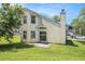 A spacious backyard showcases a patio and a lush lawn at 6595 Browns Mill Ferry Dr, Lithonia, GA 30038