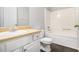 A bright bathroom features a vanity with a sink and a shower-tub combo at 6595 Browns Mill Ferry Dr, Lithonia, GA 30038