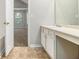 A bathroom showcases a vanity and tiled flooring at 6595 Browns Mill Ferry Dr, Lithonia, GA 30038