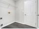 A well-lit bedroom boasts neutral walls and plush gray carpeting at 6595 Browns Mill Ferry Dr, Lithonia, GA 30038