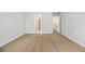 A spacious bedroom features neutral walls and plush brown carpeting at 6595 Browns Mill Ferry Dr, Lithonia, GA 30038