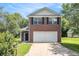 Charming two-story brick home with well-maintained lawn and attached two-car garage at 6595 Browns Mill Ferry Dr, Lithonia, GA 30038