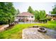 Picturesque backyard showcasing a swimming pool, a spacious lawn, and mature trees at 7392 N Mitchell N Ct, Villa Rica, GA 30180