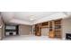 A spacious finished basement is complete with a bar area and custom built-in shelving at 7392 N Mitchell N Ct, Villa Rica, GA 30180