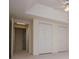 A spacious bedroom features a doorway and closets with bifold doors at 7392 N Mitchell N Ct, Villa Rica, GA 30180
