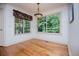 Cozy breakfast nook with hardwood floors, large windows, and decorative chandelier at 7392 N Mitchell N Ct, Villa Rica, GA 30180