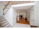 Spacious entryway with view into the living room featuring hardwood floors and fireplace at 7392 N Mitchell N Ct, Villa Rica, GA 30180