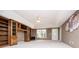 Spacious living room with built-in bookshelves and neutral color scheme with lots of natural light at 7392 N Mitchell N Ct, Villa Rica, GA 30180