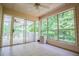 Relaxing screened porch with tile flooring and large windows offering serene views at 7392 N Mitchell N Ct, Villa Rica, GA 30180