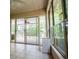 Relaxing screened porch with tile flooring and large windows offering serene views at 7392 N Mitchell N Ct, Villa Rica, GA 30180