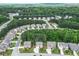 Aerial view of a home in a residential area, bordered by lush trees and green spaces at 302 Aspen Valley Ln, Dallas, GA 30157