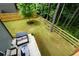 Spacious backyard featuring a patio with outdoor seating and a well-maintained lawn at 302 Aspen Valley Ln, Dallas, GA 30157