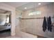 Bathroom showing a glass enclosed shower, dual shower heads, and seat at 302 Aspen Valley Ln, Dallas, GA 30157
