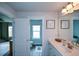 Bathroom featuring dual sinks, a walk-in shower, and modern fixtures at 302 Aspen Valley Ln, Dallas, GA 30157
