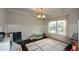 Bright bedroom features a large window, decorative ceiling, and stylish rug at 302 Aspen Valley Ln, Dallas, GA 30157