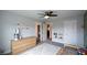 Bright toddler's bedroom showcasing a dresser, toddler bed, neutral paint, and soft carpet at 302 Aspen Valley Ln, Dallas, GA 30157