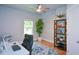 Bedroom with hardwood flooring and large window letting in natural light at 302 Aspen Valley Ln, Dallas, GA 30157