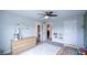 Open room with a ceiling fan, drawers, and decorated with blue car posters at 302 Aspen Valley Ln, Dallas, GA 30157