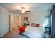 Bright bedroom featuring an ensuite bathroom, ceiling fan, and carpeted floors at 302 Aspen Valley Ln, Dallas, GA 30157