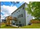 Exterior backyard shot showcasing the home, deck, patio, landscaping and air conditioning units at 302 Aspen Valley Ln, Dallas, GA 30157