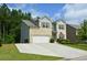 Attractive two-story home with landscaped front yard and a spacious driveway at 302 Aspen Valley Ln, Dallas, GA 30157