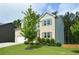 Attractive two-story home with landscaped front yard and a spacious driveway at 302 Aspen Valley Ln, Dallas, GA 30157