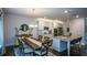 Spacious kitchen with granite countertops, stainless steel appliances, and adjacent dining area at 302 Aspen Valley Ln, Dallas, GA 30157