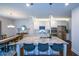 Bright and modern kitchen featuring white cabinets, granite countertops and stainless appliances at 302 Aspen Valley Ln, Dallas, GA 30157