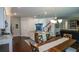 Open-concept kitchen with granite counters, stainless appliances, and adjacent dining area at 302 Aspen Valley Ln, Dallas, GA 30157