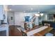 Open-concept kitchen with granite countertops, stainless steel appliances, and hardwood flooring at 302 Aspen Valley Ln, Dallas, GA 30157