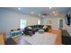 Finished living area with vinyl flooring, large sectional, and ample lighting at 302 Aspen Valley Ln, Dallas, GA 30157
