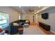 Spacious living room features wood floors, modern furniture, and ample natural light at 302 Aspen Valley Ln, Dallas, GA 30157