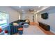Finished living area with vinyl flooring, large sectional and natural light at 302 Aspen Valley Ln, Dallas, GA 30157
