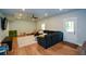 Spacious living room features wood floors, modern furniture, and ample natural light at 302 Aspen Valley Ln, Dallas, GA 30157
