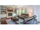 Cozy living room with fireplace, built-in shelving, and comfortable seating at 302 Aspen Valley Ln, Dallas, GA 30157