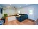Finished living area with vinyl flooring, a large sectional, and a ceiling fan at 302 Aspen Valley Ln, Dallas, GA 30157