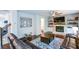 Comfortable living room featuring a brick fireplace and hardwood floors at 302 Aspen Valley Ln, Dallas, GA 30157