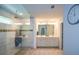 Spacious main bathroom showcasing a large shower with glass door, double sinks, and walk in closet at 302 Aspen Valley Ln, Dallas, GA 30157