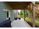 Relaxing covered patio with comfortable outdoor seating and easy access to a lush backyard at 302 Aspen Valley Ln, Dallas, GA 30157